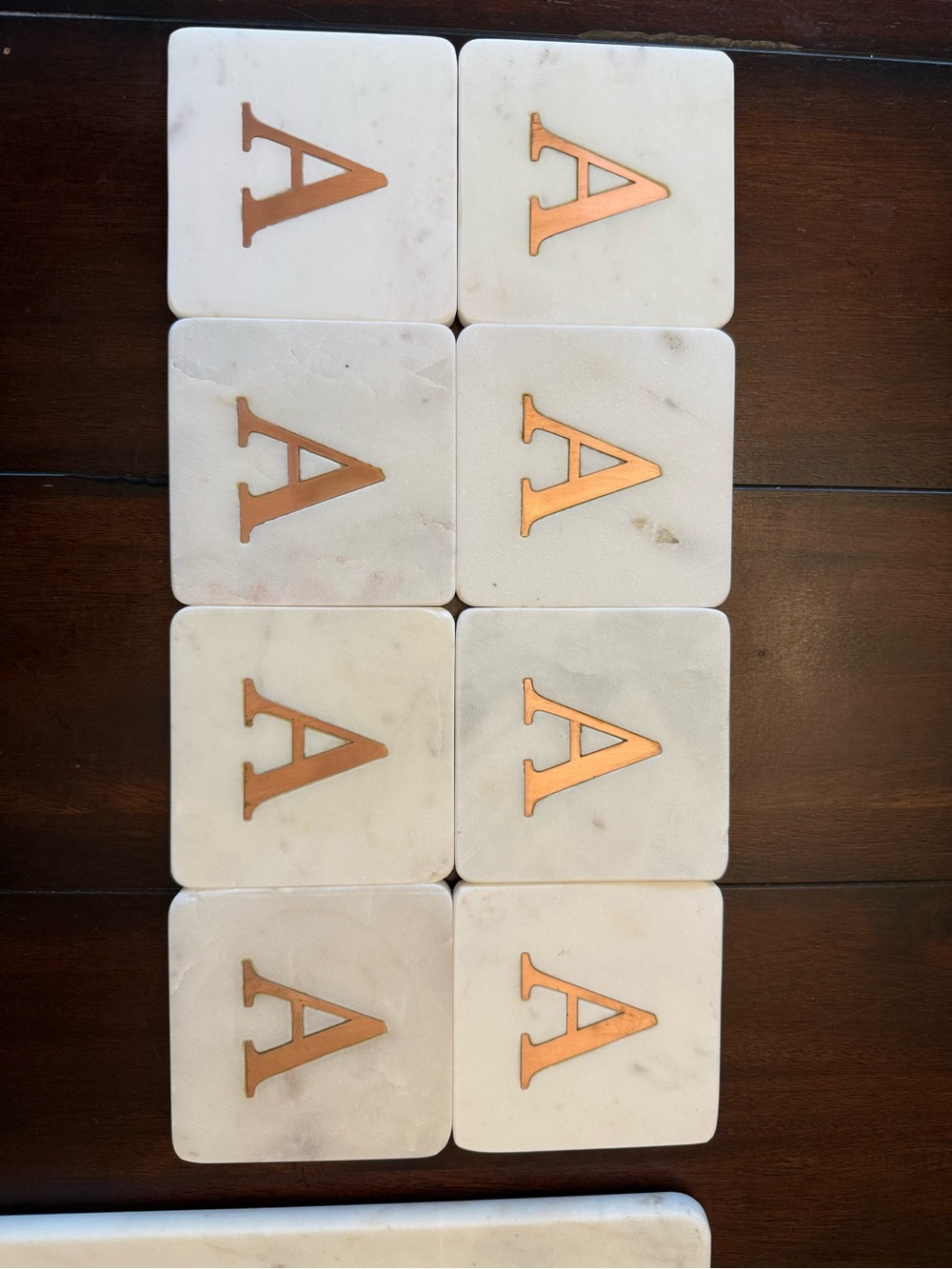 8 copper “A” monogram marble coasters